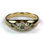 A 9ct yellow gold aquamarine and white stone set ring (P).