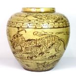 A Chinese Yuan dynasty style incised pottery vase, decorated with dragons, H. 26cm.