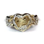 A lady's 9ct yellow and white gold diamond set heart shaped ring (O).