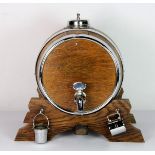 A vintage oak and silver plate mounted sherry barrel, base W. 21cm, H. 21cm.