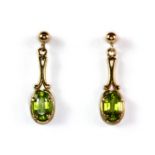 A pair of 9ct yellow gold (stamped 375) peridot set drop earrings, L. 2.4cm.