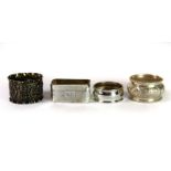 Four silver napkin rings.