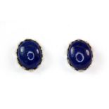 A pair of 9ct yellow gold mounted lapis lazuli stud earrings, L. 1cm.