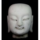 A Chinese carved marble Buddha head, H. 24cm.