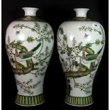 A superb pair of Chinese hand painted famille vert porcelain vases decorated with birds among