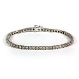 A 9ct white gold diamond line bracelet set with 3.1ct of brilliant cut diamonds.