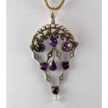 An antique yellow and white metal (tested 14ct gold) pendant set with amethyst, rose cut diamonds