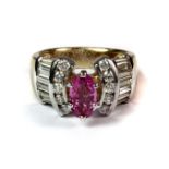 A yellow metal ring tested 18ct gold set with a 1.16ct marquise cut pink sapphire and approx. 1.