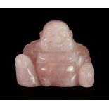 A Chinese carved rose quartz figure of a seated Buddha.