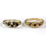 Two 9ct yellow gold rings, one set with sapphires and one set with rubies (both size L.5).