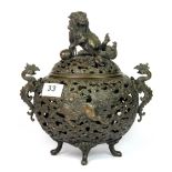 A 19th century Chinese cast pierced bronze censer decorated with Qilin and with phoenix handles,