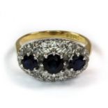 An 18ct yellow and white gold sapphire and diamond set ring (L).