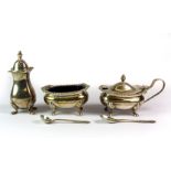 A matching three piece hallmarked silver cruet set, each piece raised on four feet.