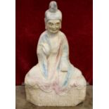 A 19th / early 20th century carved marble Temple garden figure of a seated deity, with remnants of