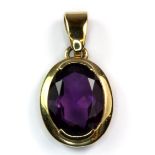 A 9ct yellow gold amethyst set pendant, L. 2cm.