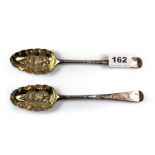 A pair of Georgian hallmarked silver berry spoons, worn mark L. 22cm.