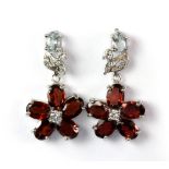 A pair of 925 silver flower shaped drop earrings set with garnets, blue topaz and white stones, L.