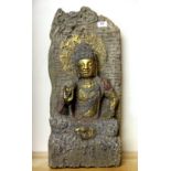 A superb old carved stone temple figure of the seated Buddha with re-gilding and re-painting, H.