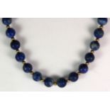 A lapis lazuli bead necklace on a 14ct yellow gold (stamped 585) clasp.