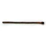 An early 20th century oriental carved bamboo walking stick, L. 78cm.