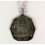 A hallmarked silver Royal Coat of Arms of Scotland pendant and chain in its original box.