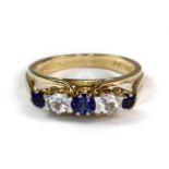 A 9ct yellow gold sapphire and white topaz set ring (N.5).