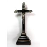 An 18th century Continental ebonised wood and silver (tested) crucifix, H. 72cm.
