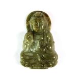 A richly coloured carved Chinese jade amulet of the seated Guan Yin, H. 5.4cm.