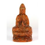 A carved walnut wood figure of the Goddess Guan Yin, H. 11cm.