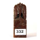 An unusual Chinese carved red soapstone seal, mounted with a winged mythical creature, H. 12cm.