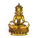 A Tibetan gilt bronze figure of a seated Tara, H. 28cm.