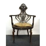 An unusual 19th century carved beechwood arm chair.