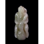 A 19th century Chinese carved nephrite jade figure of a fisherman with his catch, H. 8.5cm.