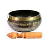 A Tibetan bronze singing bowl, Dia. 17cm.