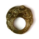 An early man's Chinese carved jade ring, worn for protection against evil spirits, Dia. 5.5cm.