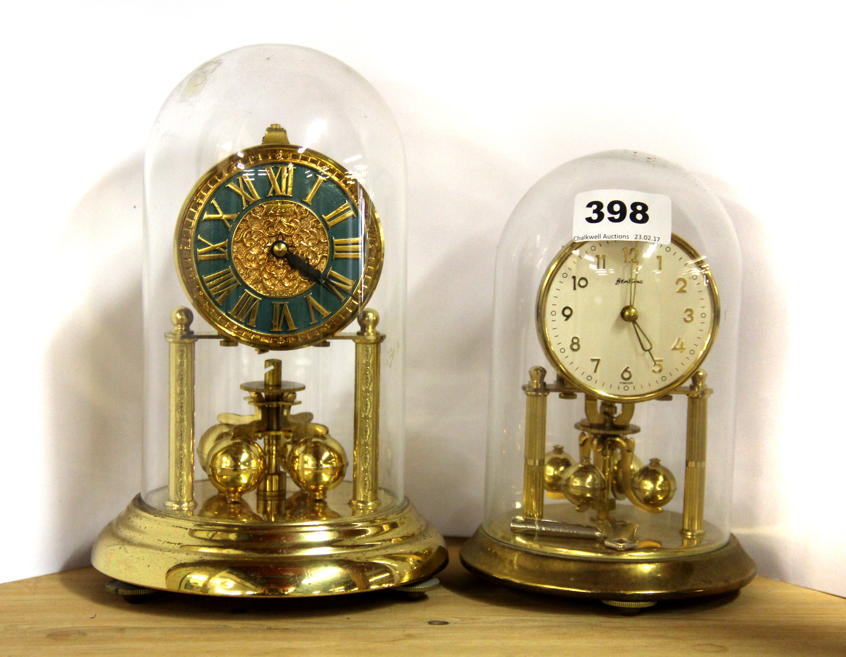 Two small four hundred day mantle clocks with domes, H. 22cm & 18cm.