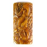 A Chinese carved bone dragon amulet, H. 9cm.