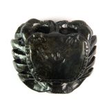 A Chinese dark green soapstone scroll weight in the form of a crab, W. 7cm, H. 4cm.