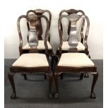 A set of four heavy quality mahogany ball and claw foot dining chairs.