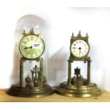 A four hundred day gilt brass mantle clock and dome, together with a further mantle clock without