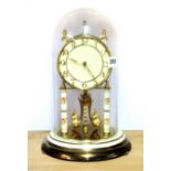 An enamelled brass four hundred day mantle clock, H. 30cm.