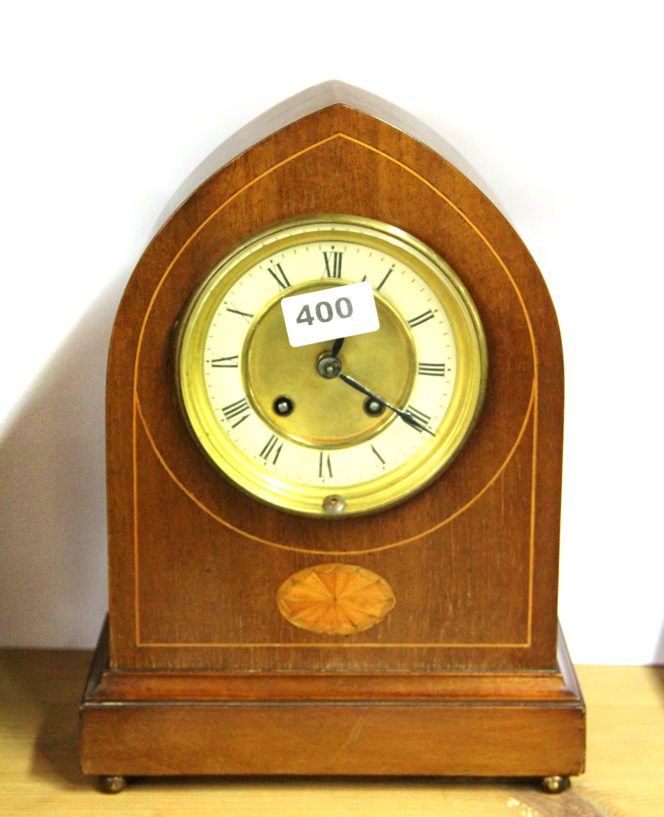 An Edwardian inlaid mahogany mantle clock, H. 30cm.