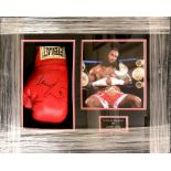 Boxing Interest. A framed autographed boxing glove and photograph of Lennox Lewis, 62 x 50cm.