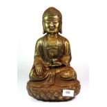 A Chinese gilt cast iron figure of a seated Buddha, H. 33cm.