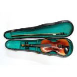 A cased half sized violin.