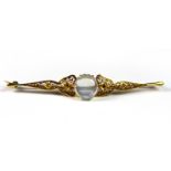 A silver gilt stone set filigree bar brooch, L. 9cm.