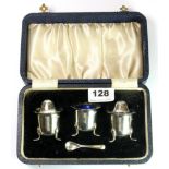 A hallmarked silver three piece cruet set, comprising of a salt, pepper and a mustard spoon, each