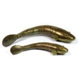 Two 19th century Indian brass articulated fish with stone set eyes, L. 20cm and 30cm. Prov.