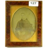 A framed 19th century daguerreotype of a lady in a bonnet, in a inlaid frame, 19.5 x 15cm.