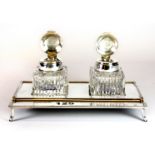 A late 20th century hallmarked silver twin bottle desk stand, with reeded border and integrated